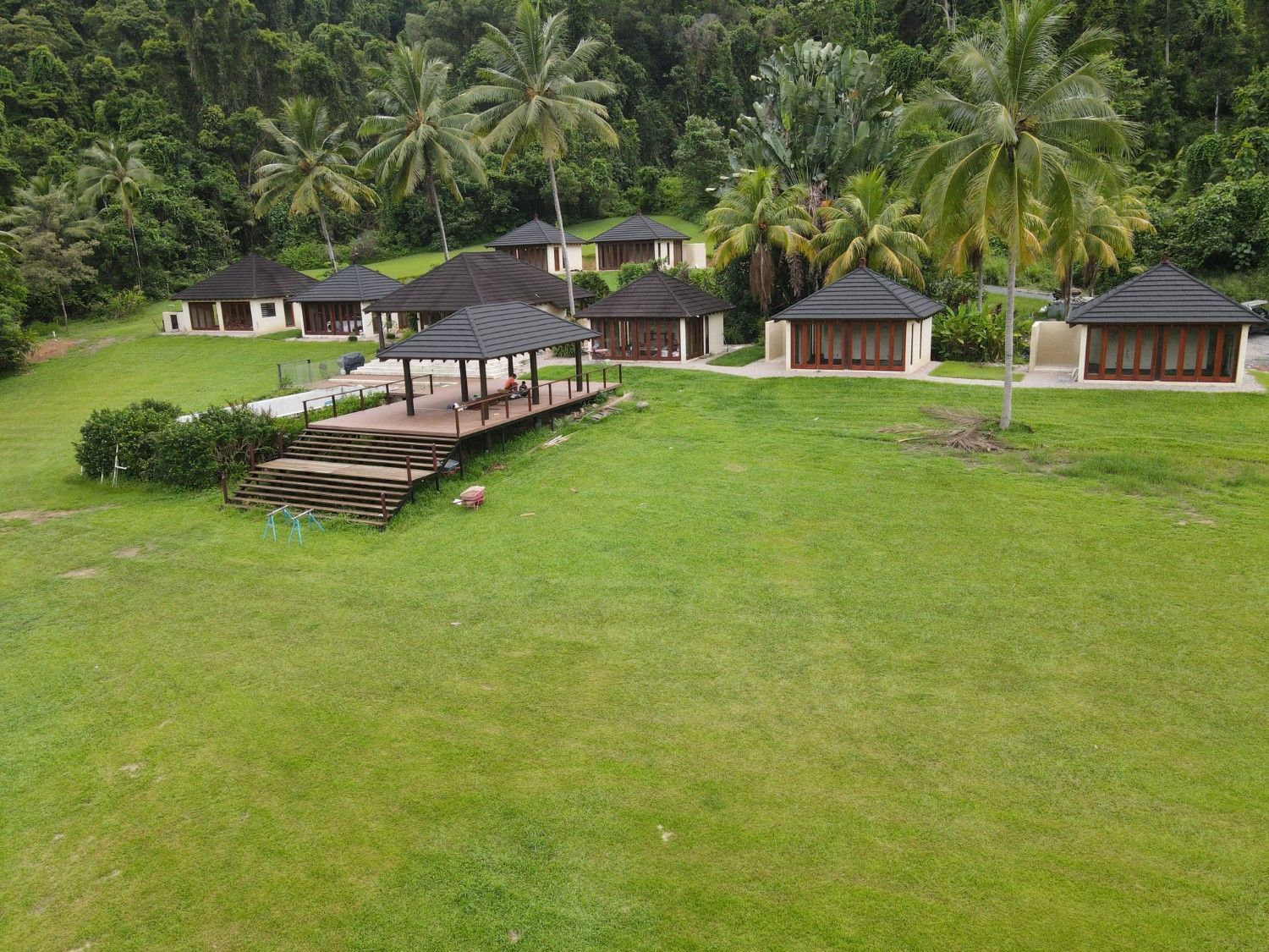 Lush Green Lawn with Several Cabins and A Gazebo — High Performance Roof Tiling P/L in Kewarra Beach, QLD