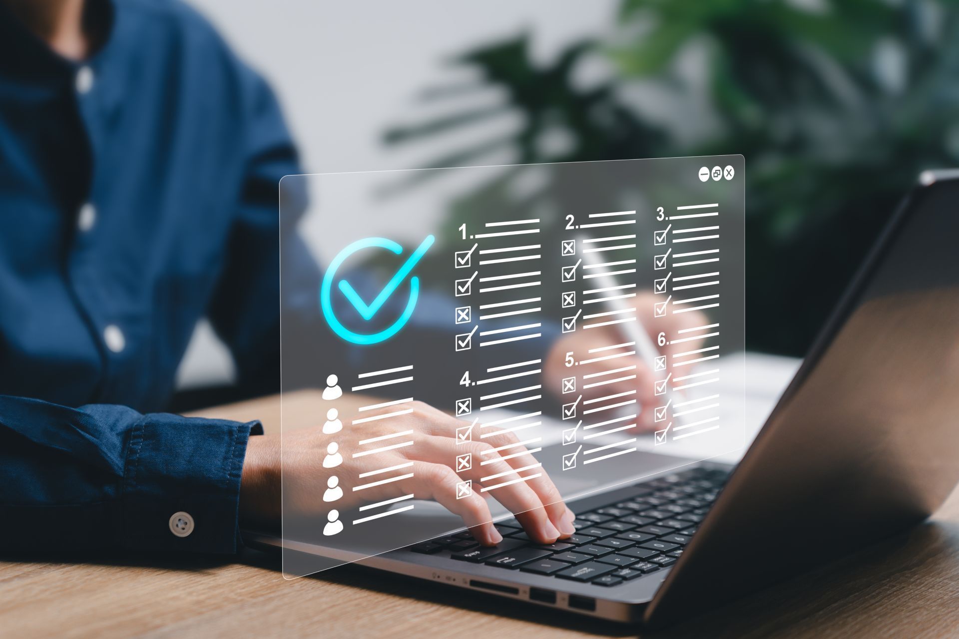 Person using a laptop, interacting with a digital checklist with a checkmark, likely completing a task.