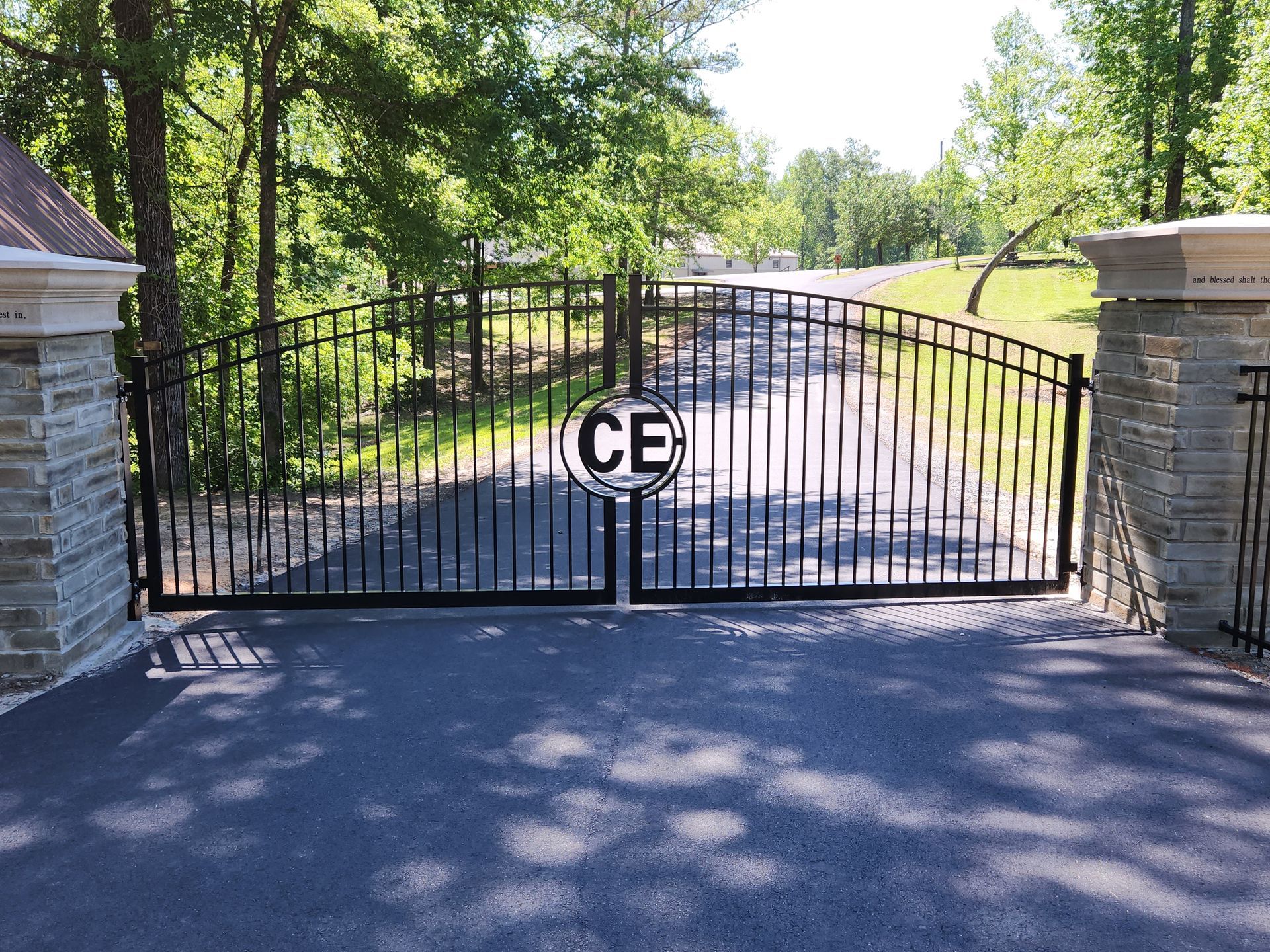A wrought iron gate with the letters ce on it