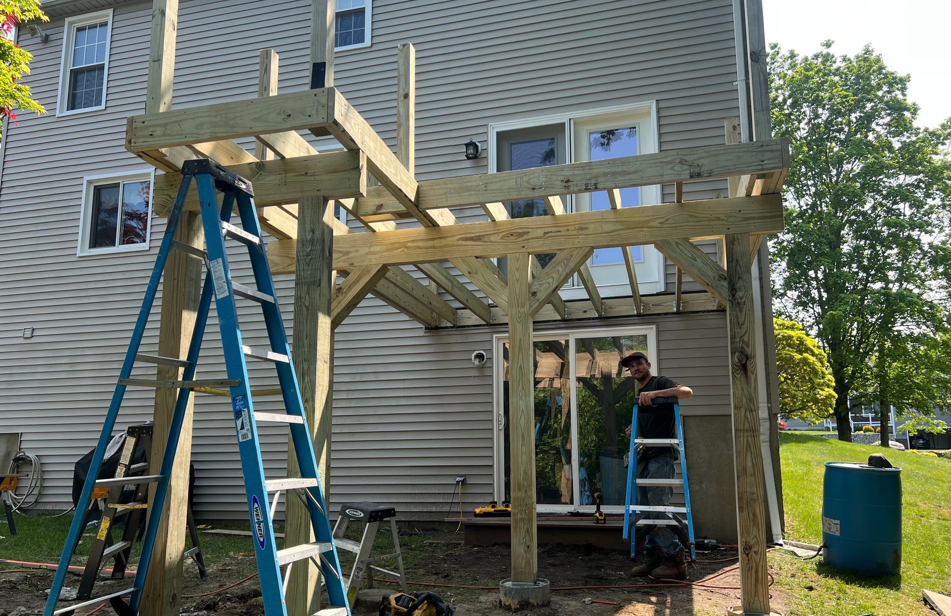 Central MA backyard deck being framed in