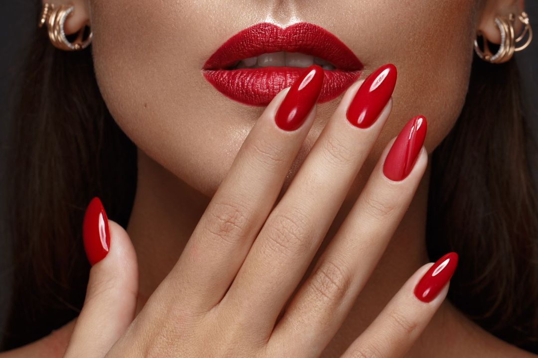 A woman hand with red manicure