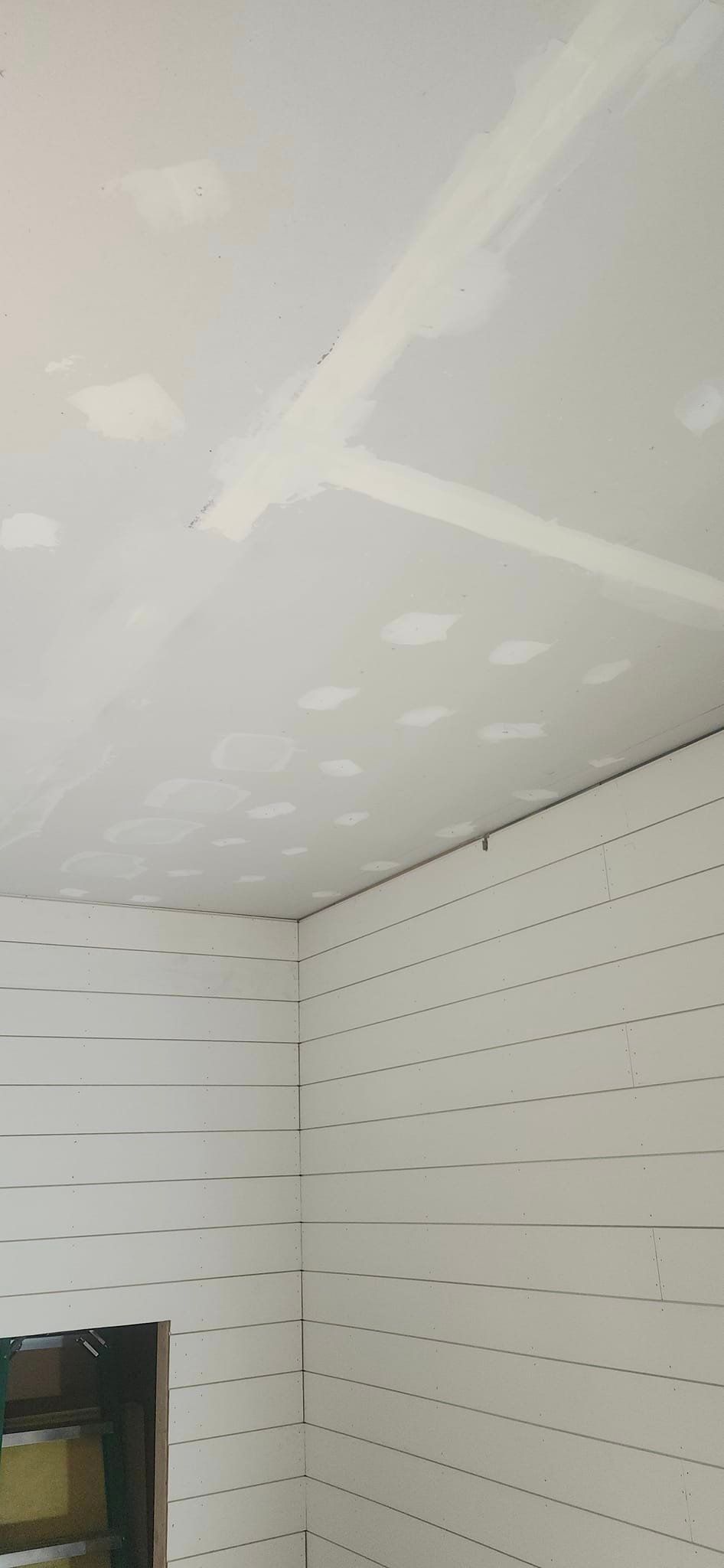 A room with white walls and a white ceiling.