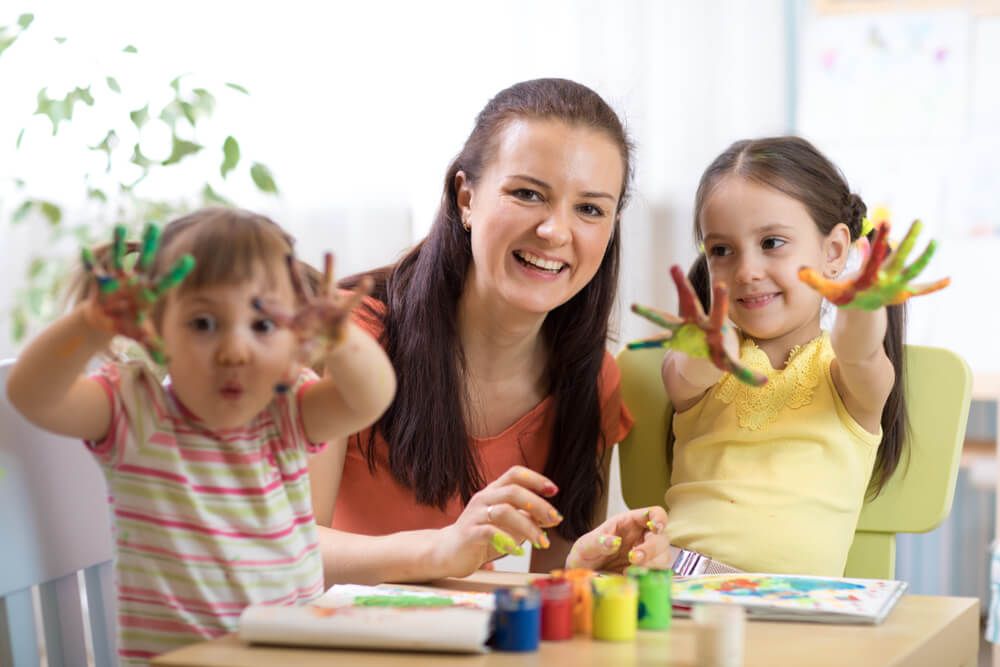 Cheerful Children and Woman Having Fun — Preschool in Coffs Harbour