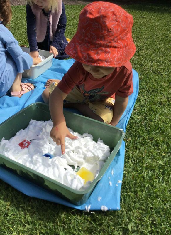 A Child Wearing a Red Hat is Playing with Cream — Enrolment Information