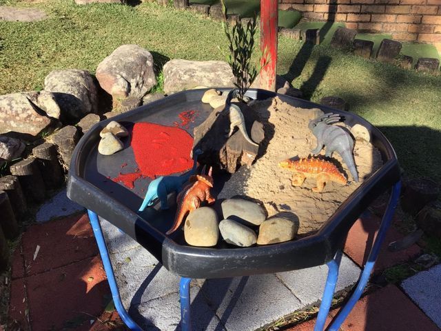 Dinosaur Toys in Table Sandpit for Creative Play — Coffs Harbour Childcare Info