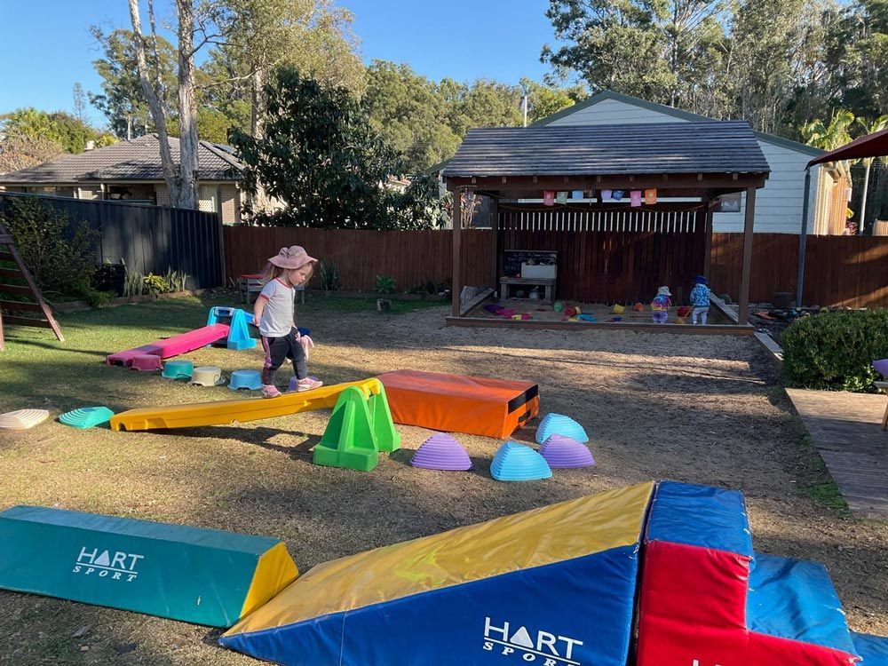 Child Engaging in Playful Activities in the Yard — Preschool in Coffs Harbour