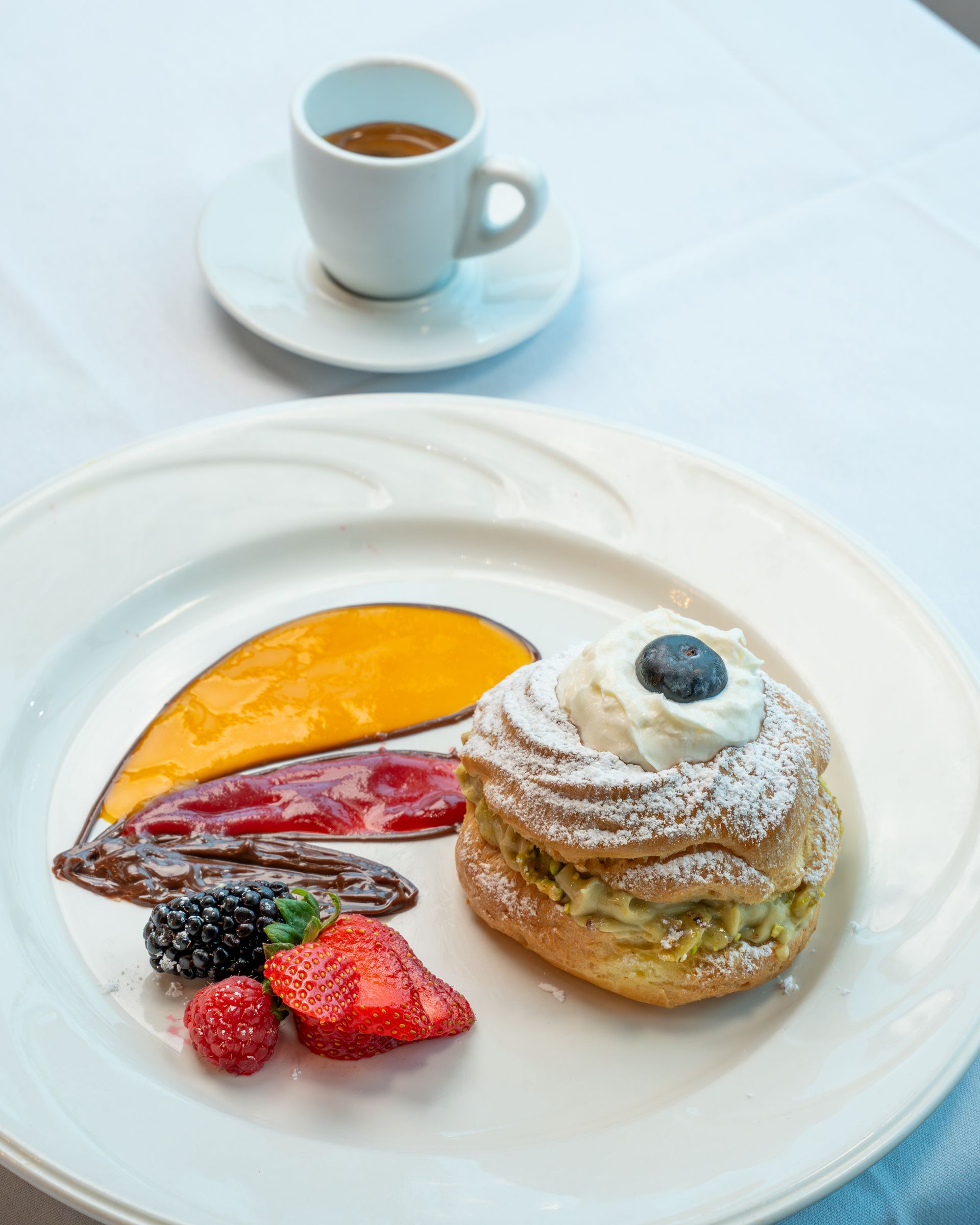 A close up of a dessert on a plate on a table.