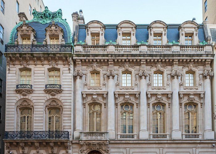Two views of a grand staircase with red carpet, ornate railing, and a decorated ceiling.