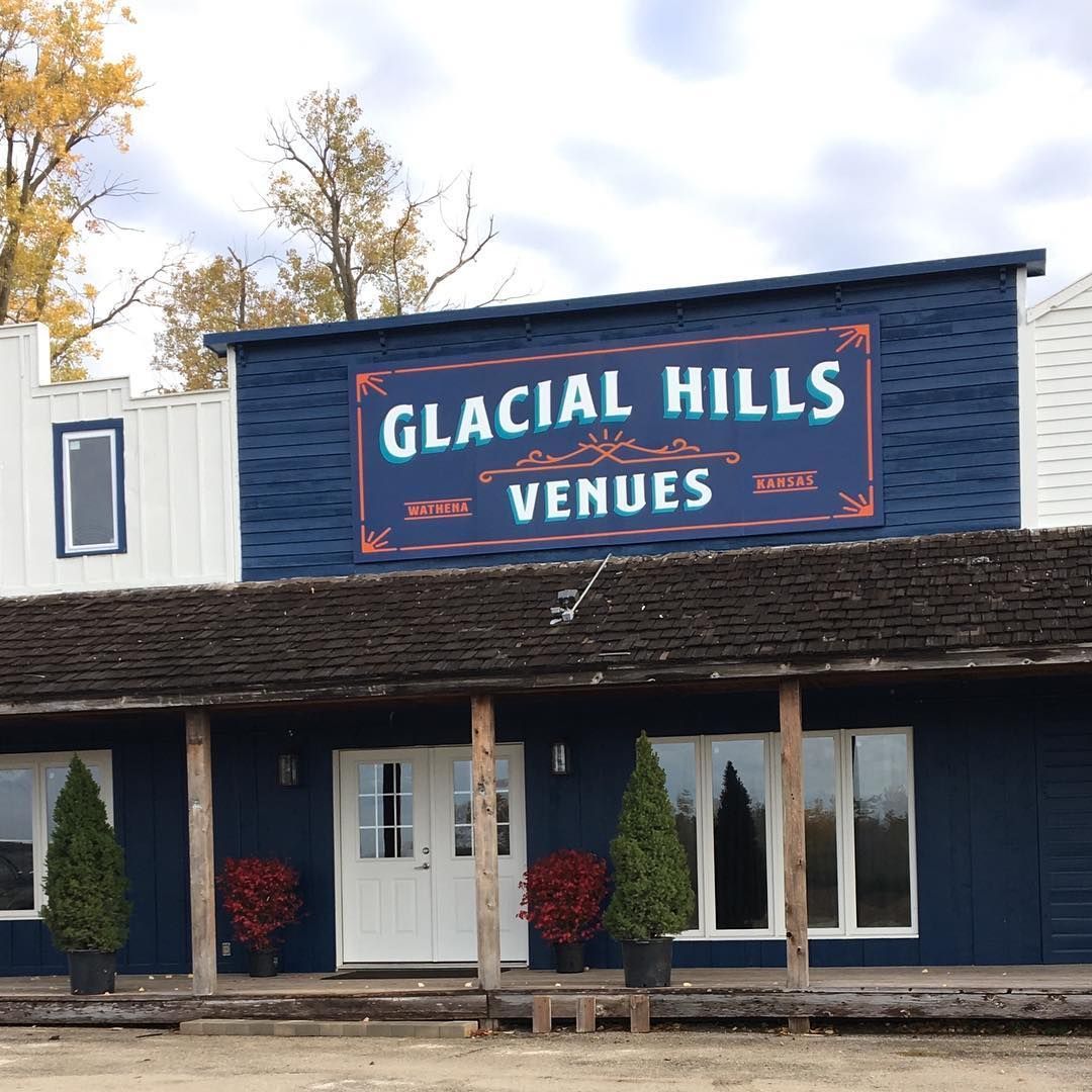 A blue building with a sign that says glacial hills venues