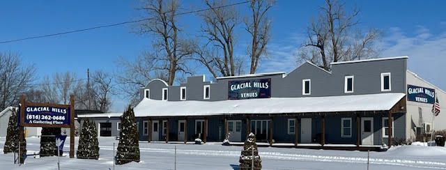 A snowy building with a sign that says dairy mill