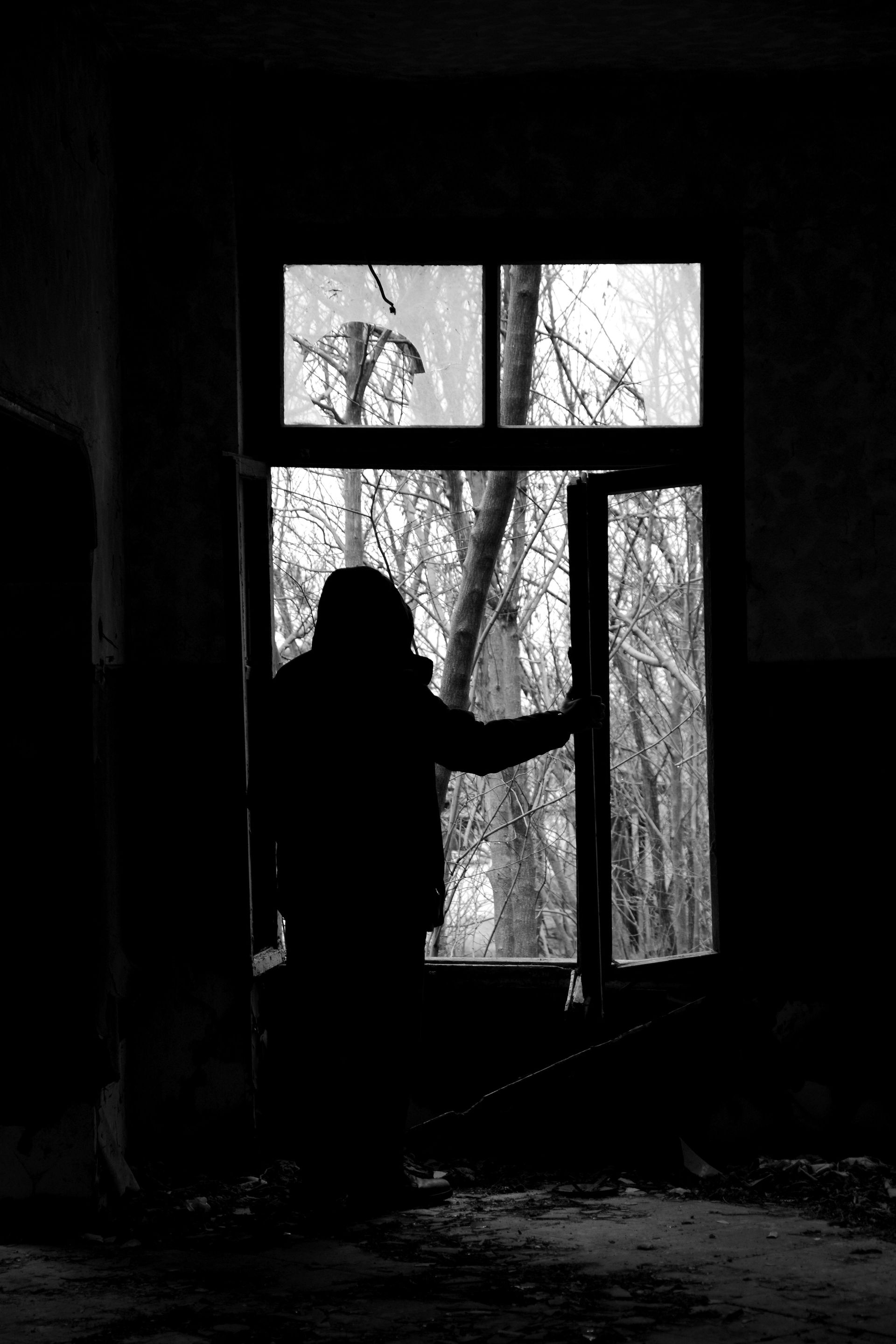 A professional window installer replacing a window