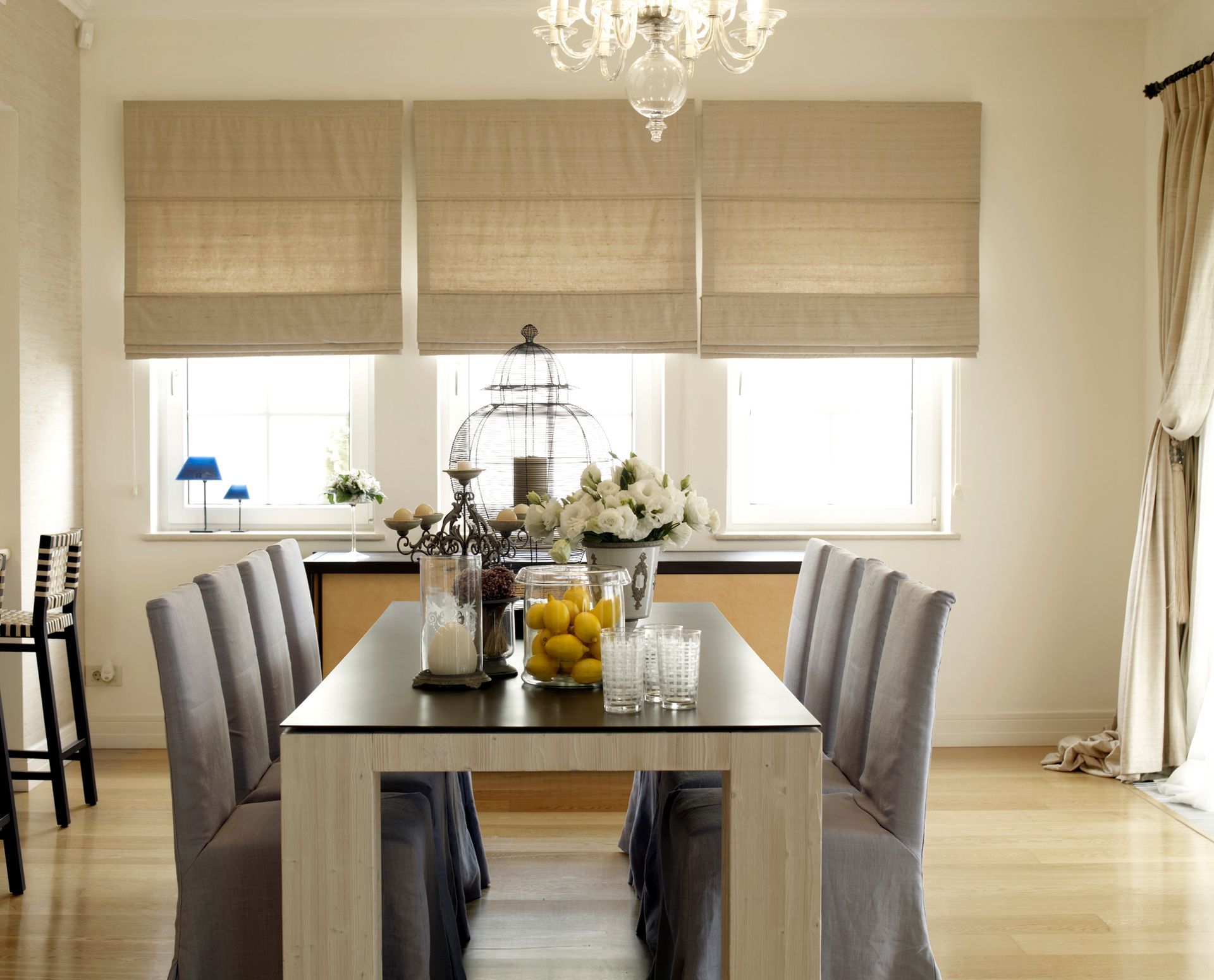 Modern Dining Room with Large Windows and Stylish Home Blinds, Natural Light Enhancing the Cozy Ambi