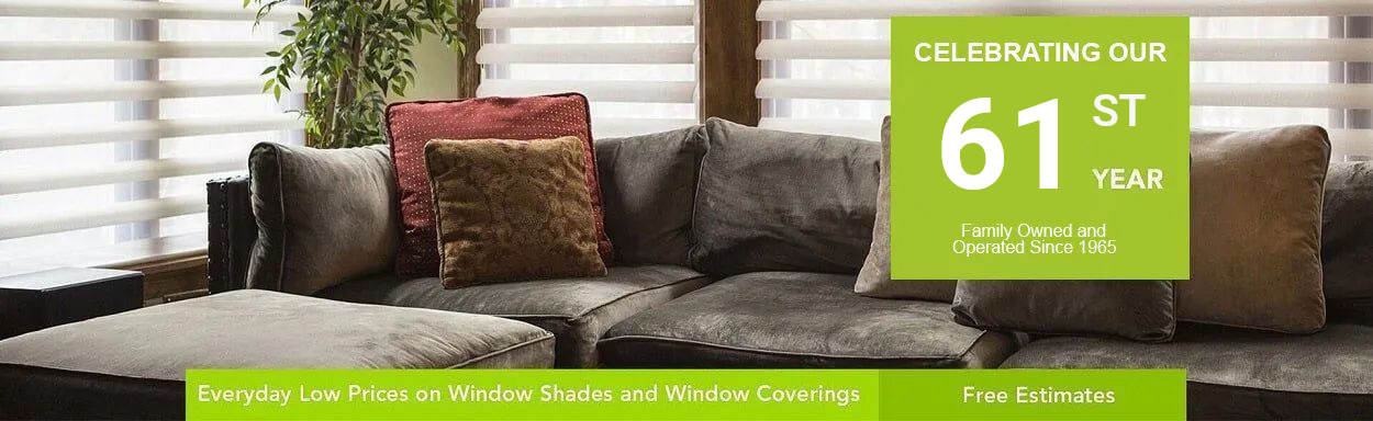 A living room with a couch and a sign that says 61st year