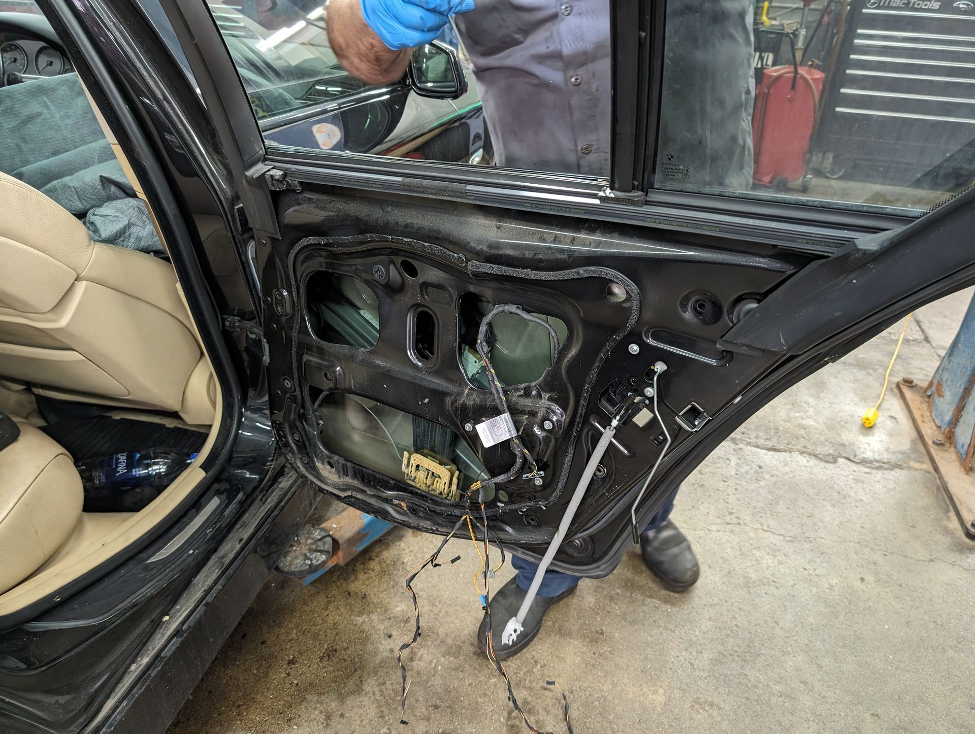 Door repair of BMW vehicle | Autopia Auto Repair - Bloomington