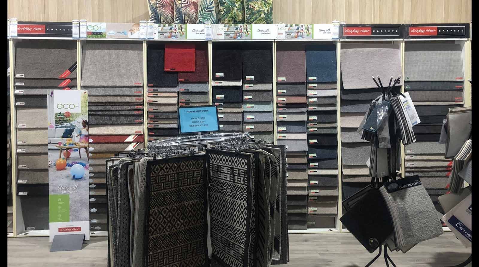 A Store With a Lot of Carpets on Display — Bayside Carpets & Flooring in Laurieton, NSW