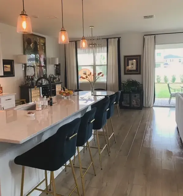 Living room with custom draperies, accent pillows, and finishing details