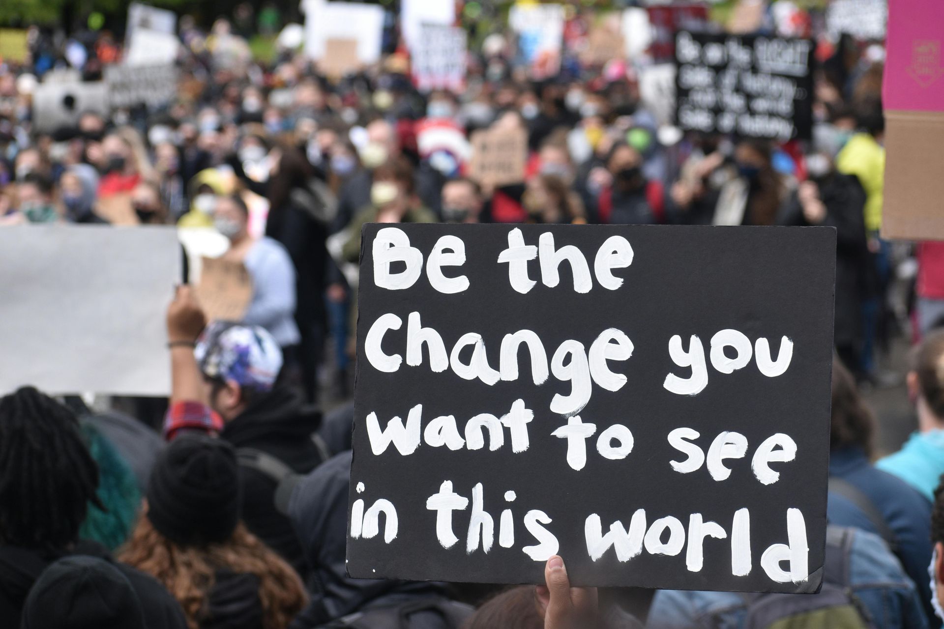 A sign that says be the change you want to see in this world