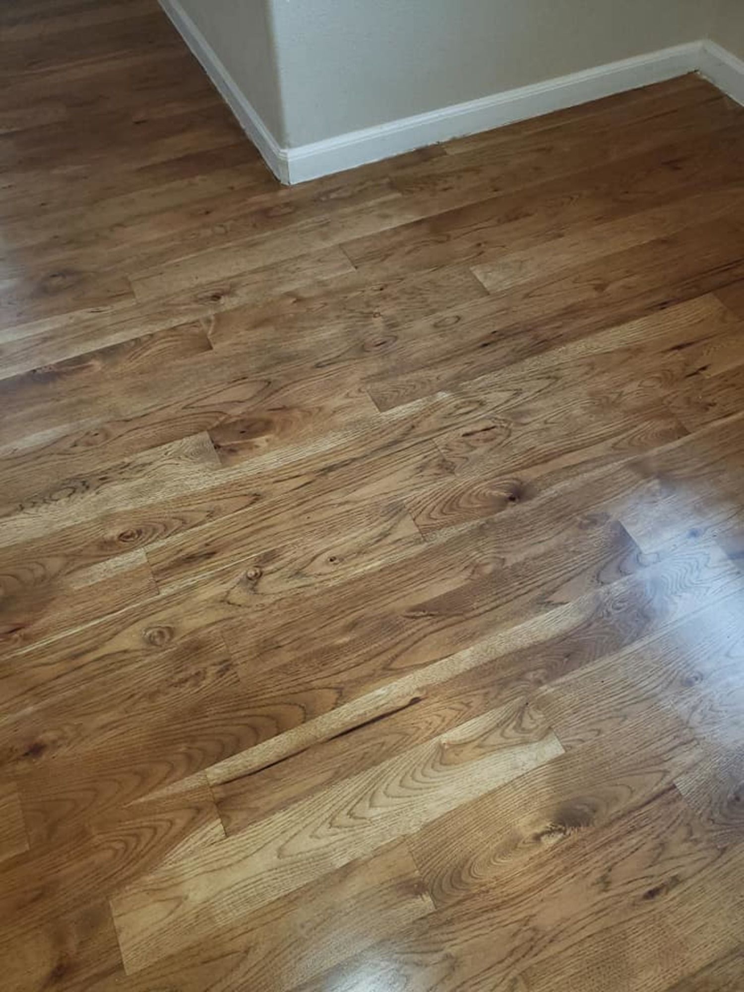 A close up of a wooden floor in a room.