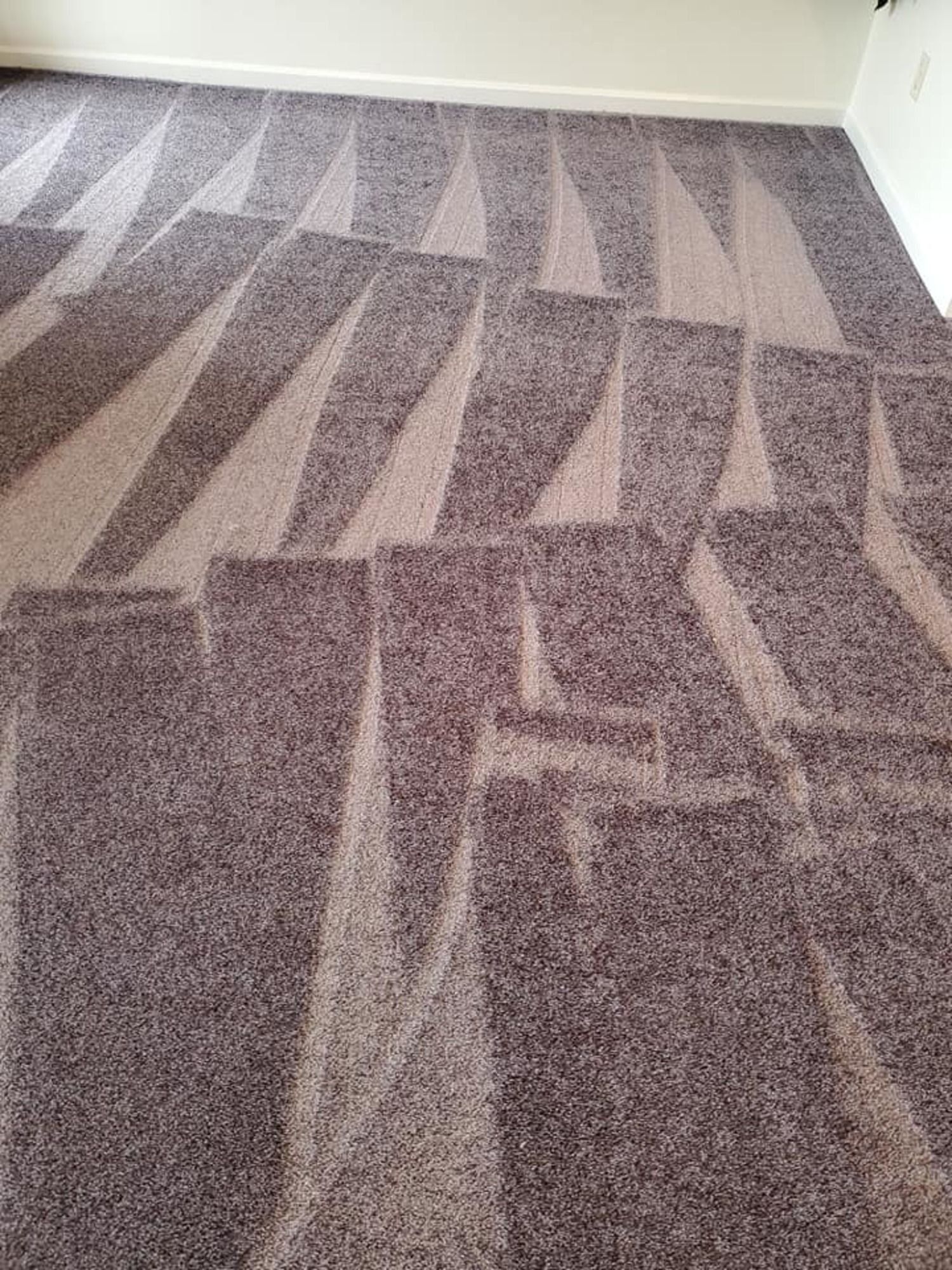 A carpet in a living room with a pattern on it.