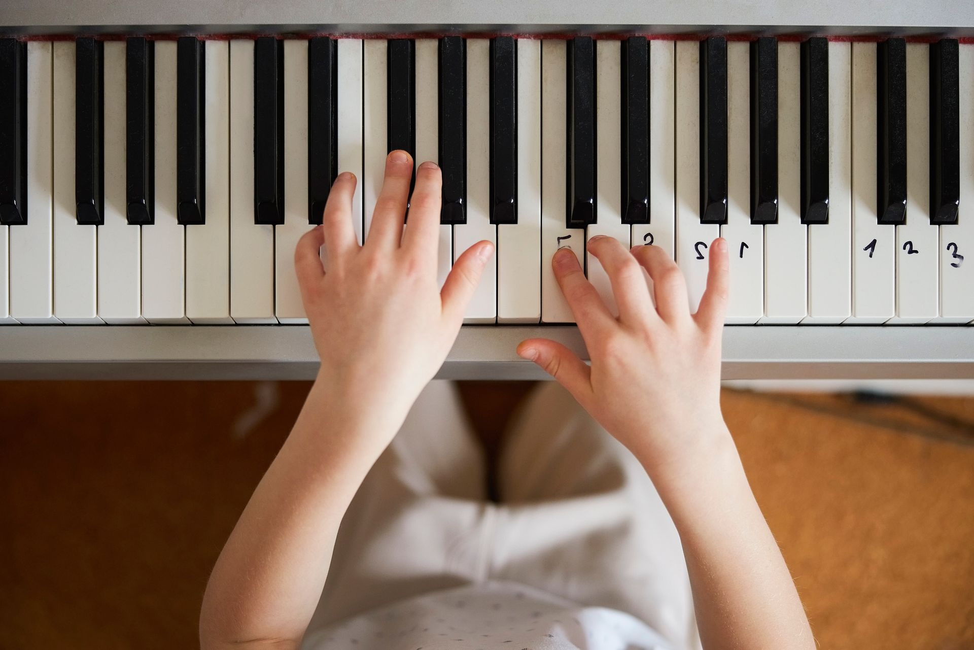 A Child Is Playing A Piano — Tully, NY — Tritone Pianos