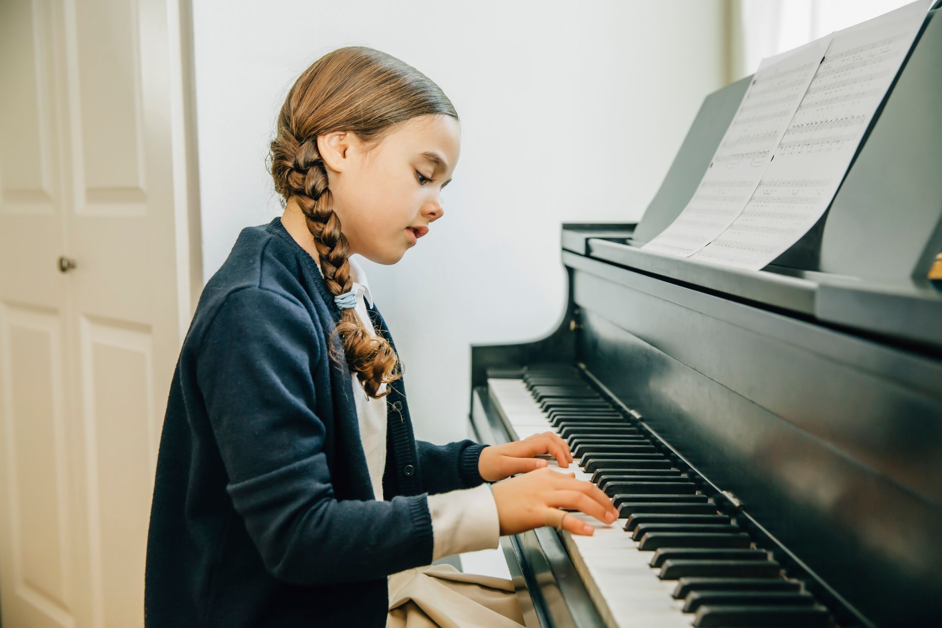Woman Child Playing Piano — Tully, NY — Tritone Pianos