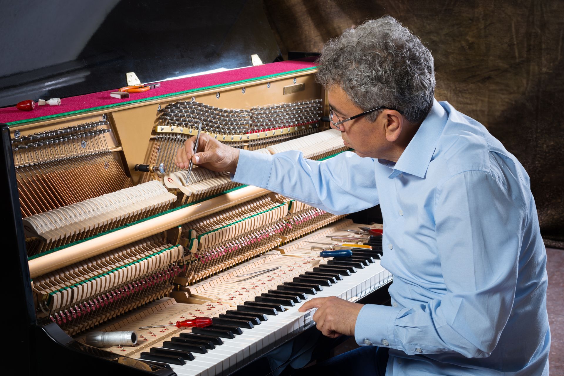 Man Tuning Piano — Tully, NY — Tritone Pianos