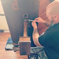 Man Is Repairing Piano — Tully, NY — Tritone Pianos