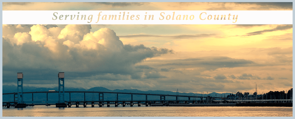 Serving Families in Solano County text over an image of a pier