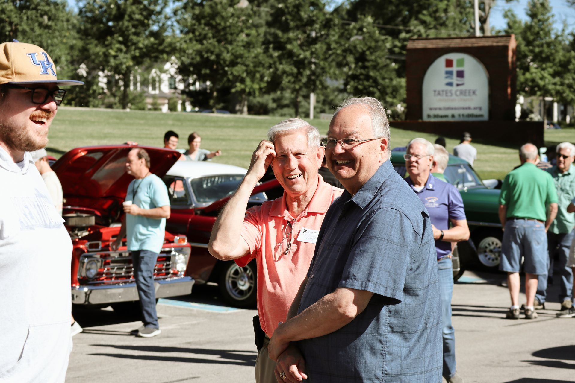 A group of men are standing in front of a sign that says service club