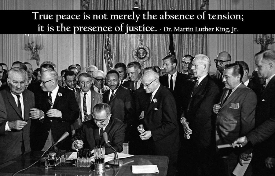 A black and white photo of a man signing a document with a quote from dr. martin luther king jr.