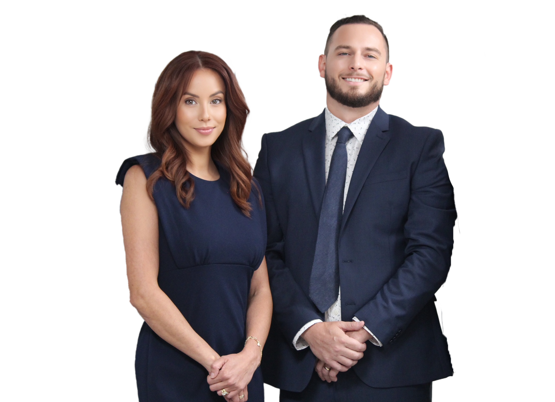 A man and a woman in suits and ties are standing next to each other.