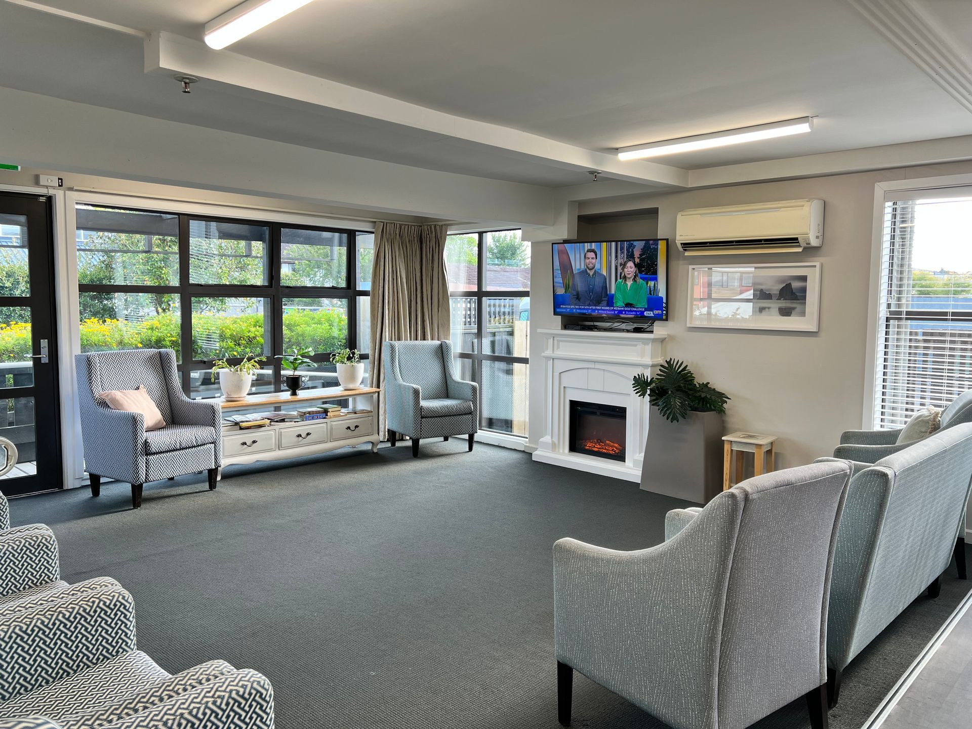 A living room filled with furniture and a fireplace.