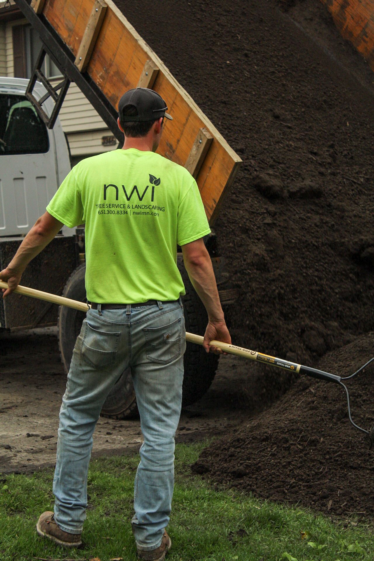 NWI landscaper pouring dirt