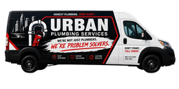 Neon-style sign reading “URBAN PLUMBING SERVICES” in pink, blue, and white on a dark background