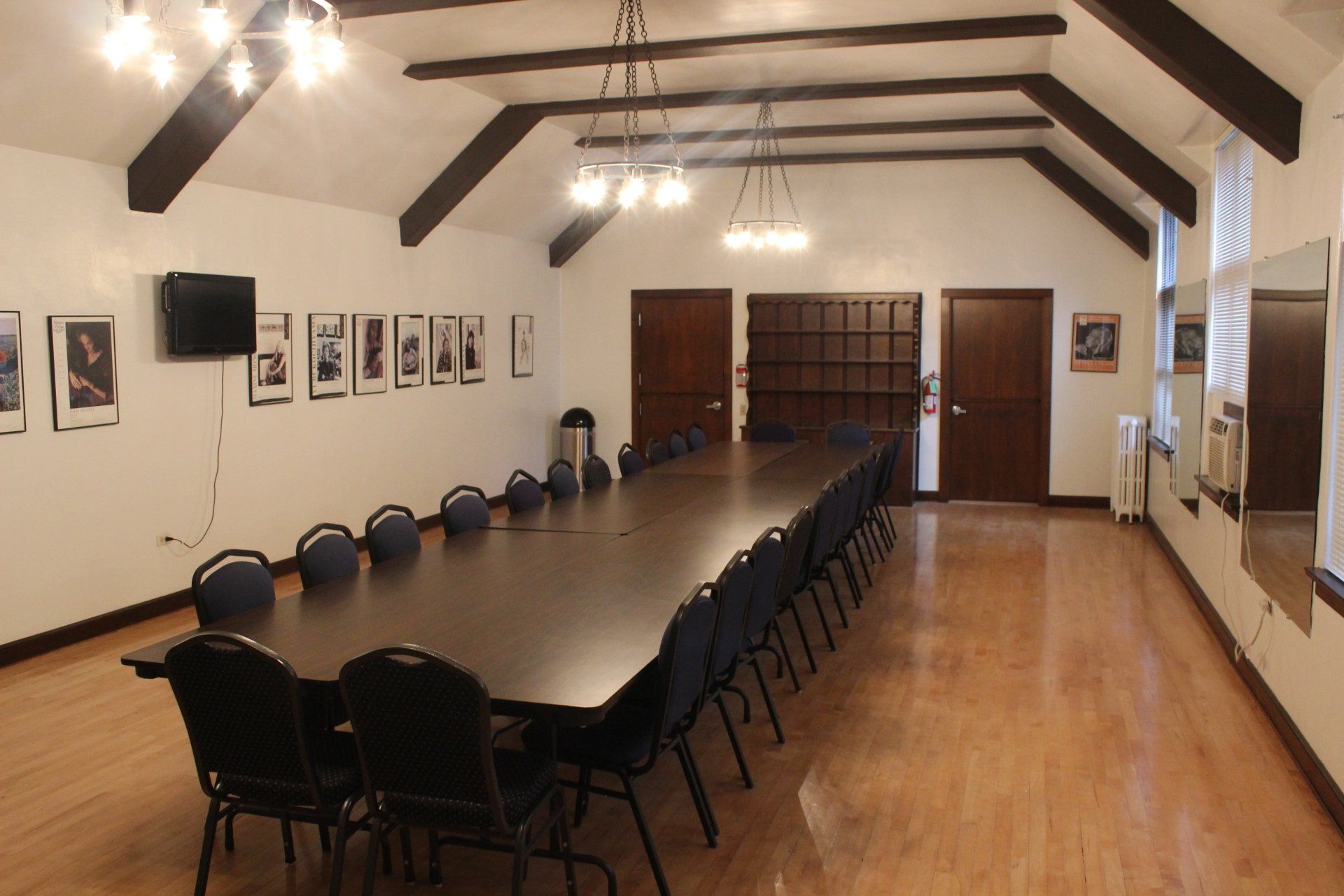 A large room with a long table and chairs