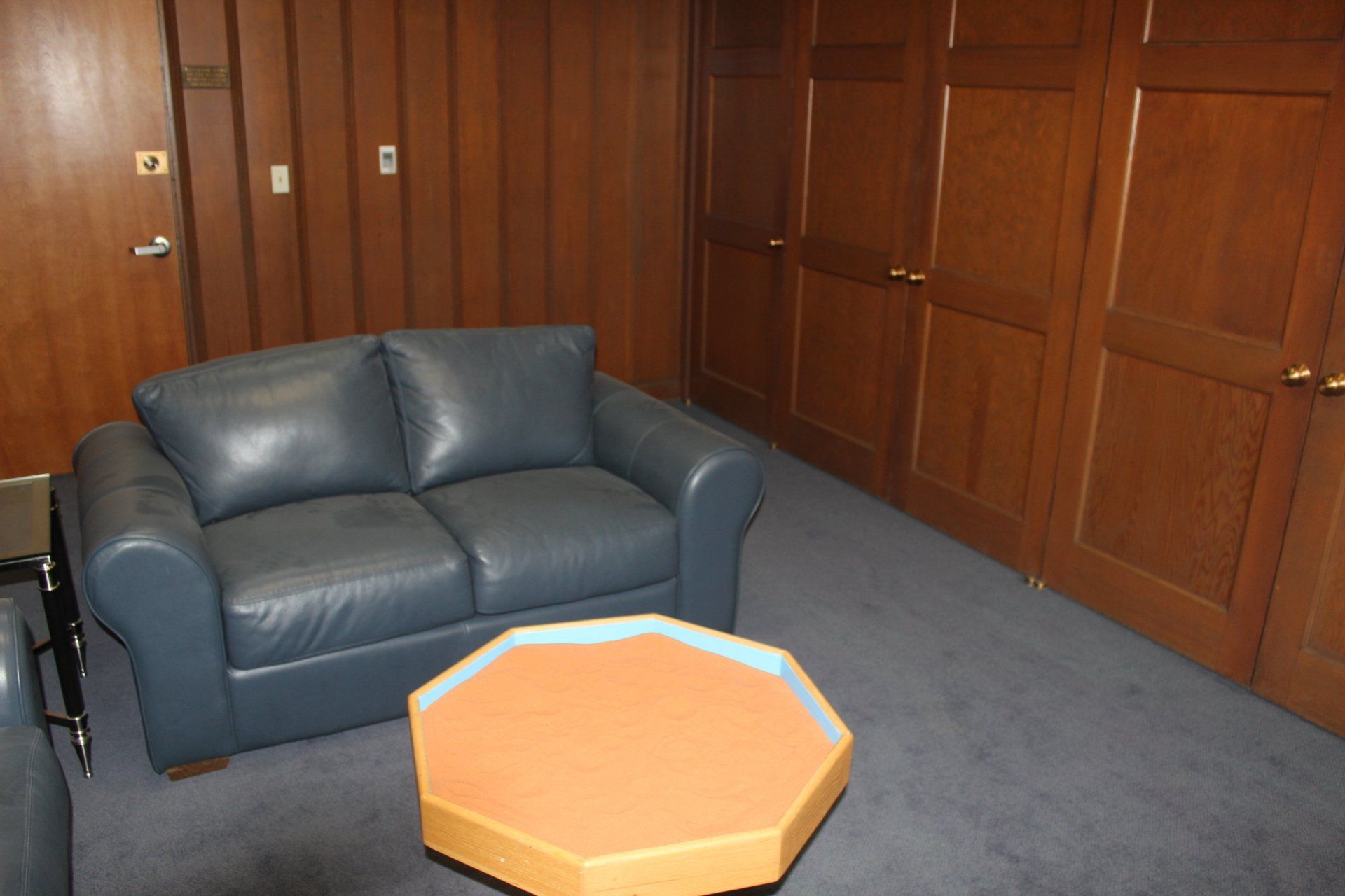 A living room with a couch and a table