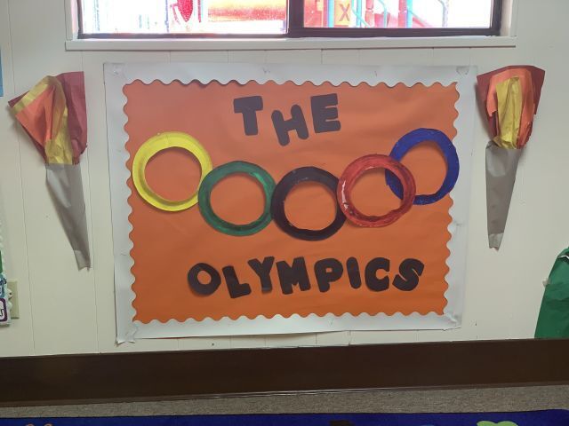 An orange sign that says the olympics on it