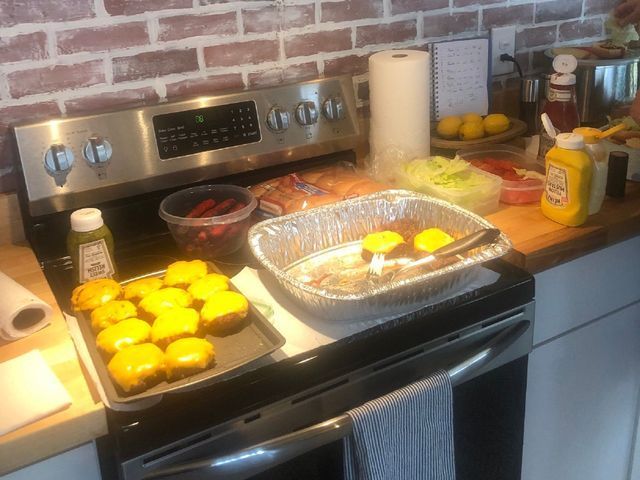 A stove top with a bunch of food on it