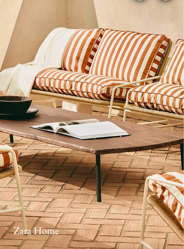 Outdoor soft seating by Zara Home - brown and white stripes with a wooden table.