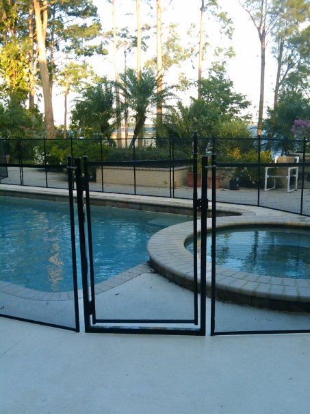 A pool with a fence around it and a gate