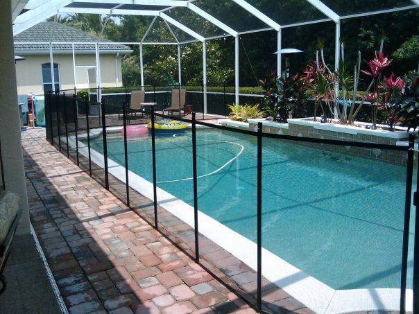 A large swimming pool with a fence around it