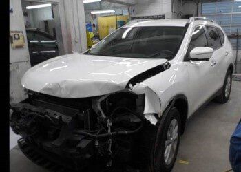 After Front Damaged White Car — Dover, OH — Cua Refinishing Co.