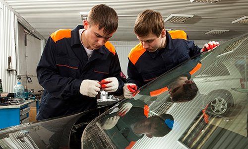 Collision Center — Mechanics Replacing Car Window in Dover, OH