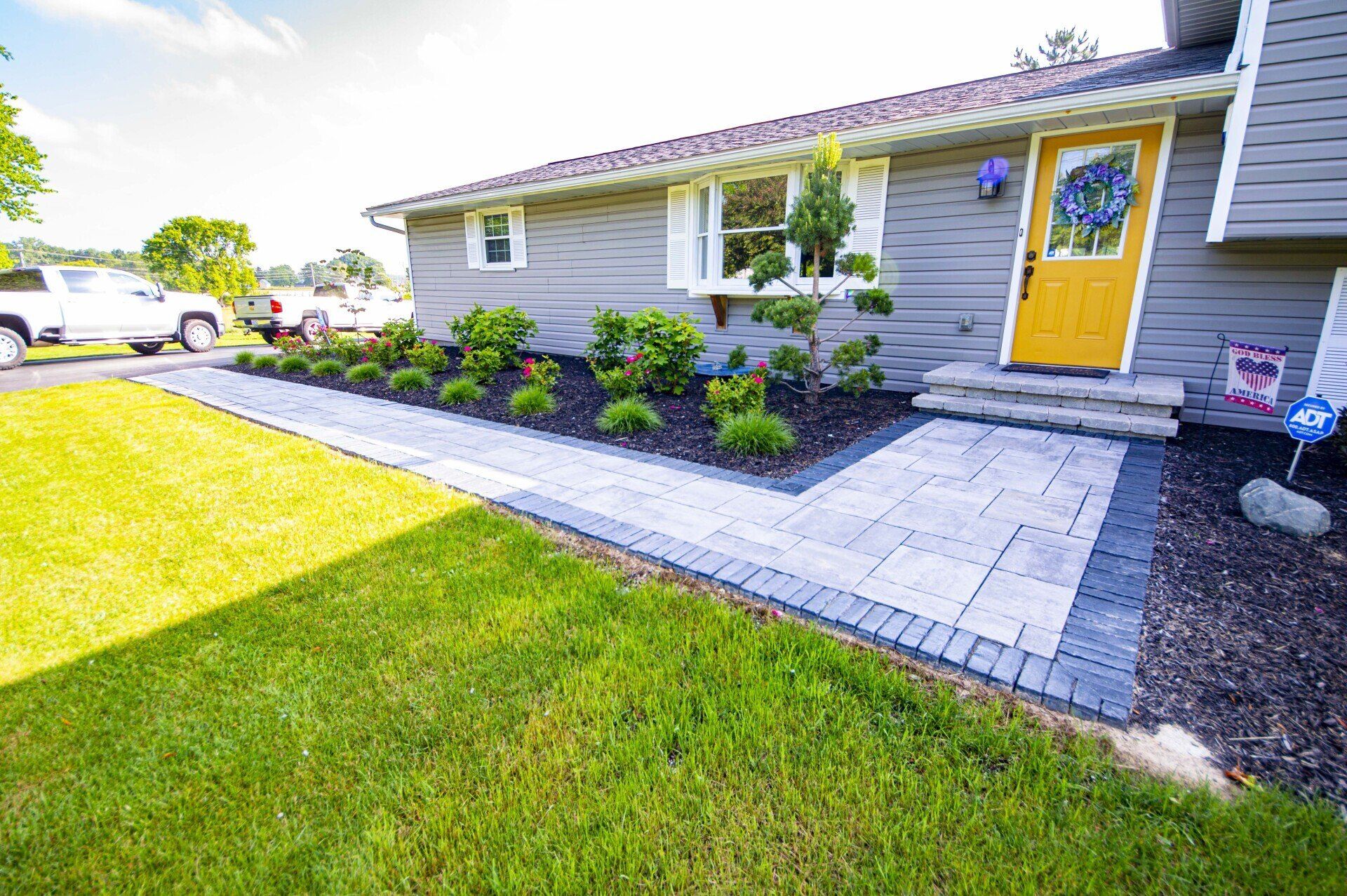 Concrete walkway in grey edged with blue