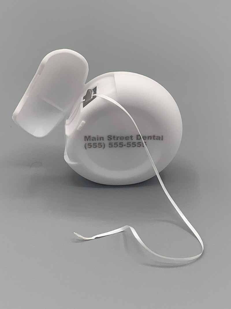 A roll of dental floss from main street dental