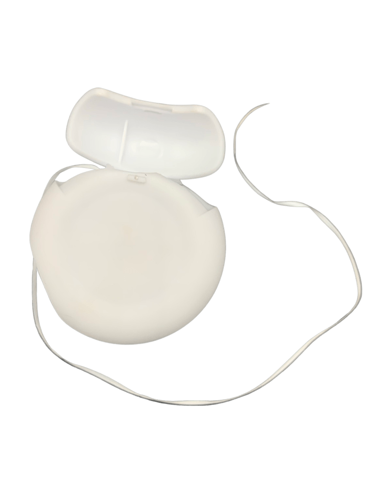 A white dental floss in a plastic case on a white background.