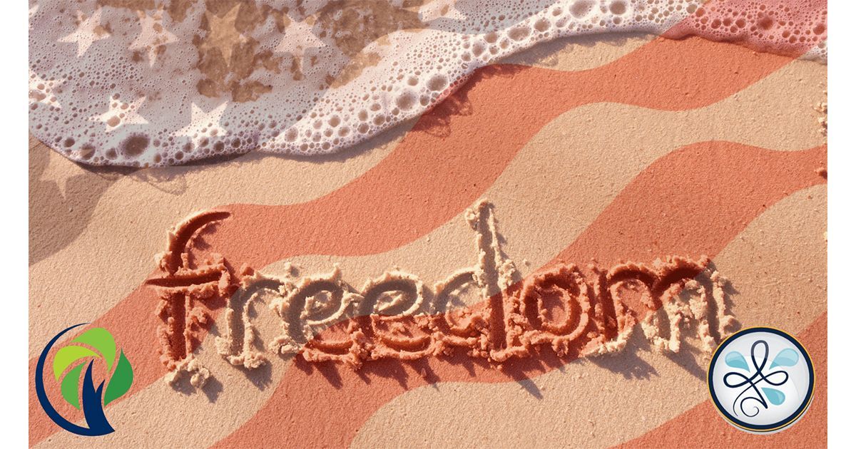 the word freedom is written in the sand on a beach