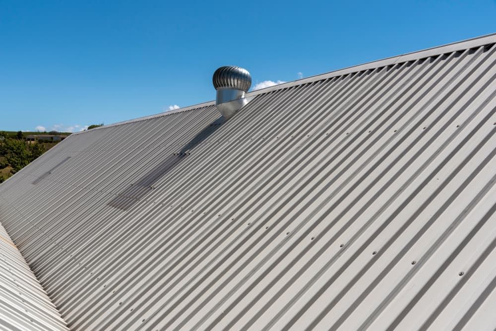 A White Metal Roof with A Chimney on Top of It — Rooftop Northern Rivers In Ballina, NSW