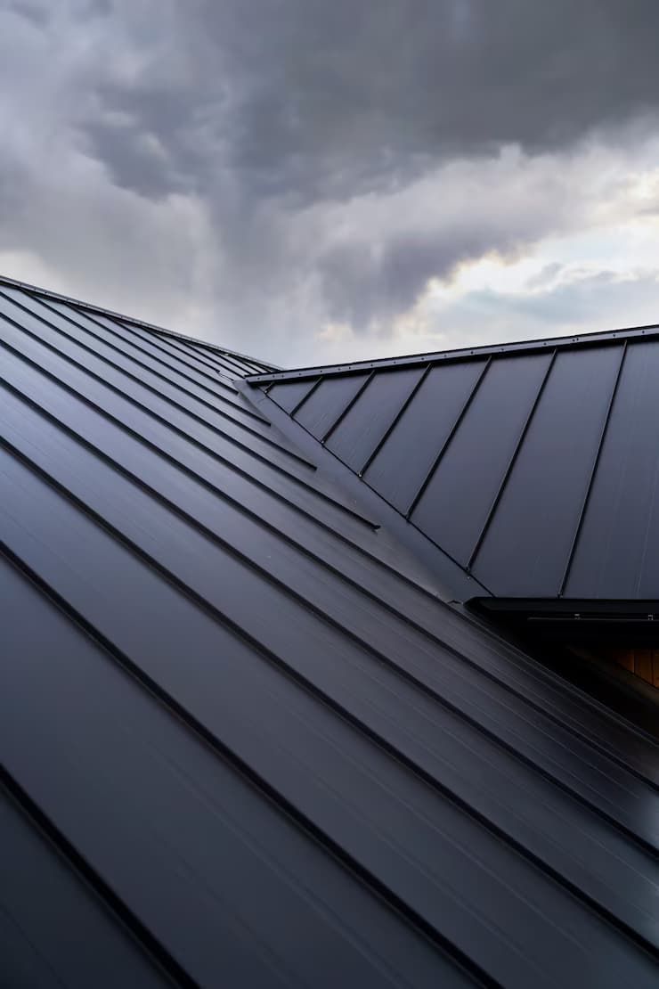 A Black Roof with A Cloudy Sky in The Background — Rooftop Northern Rivers In Lismore, NSW