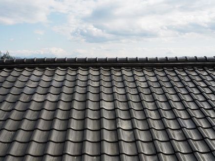 A Close Up of a Tiled Roof With a Cloudy Sky in the Background — Rooftop Northern Rivers In Ballina, NSW